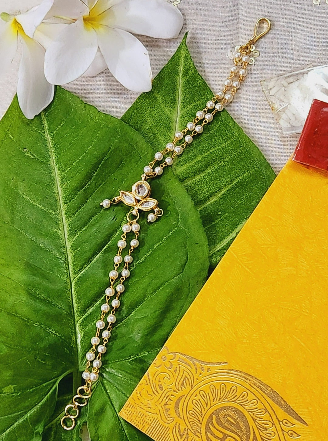 Diya Shaped White Kundan Bracelet Rakhi - QUEENS JEWELS
