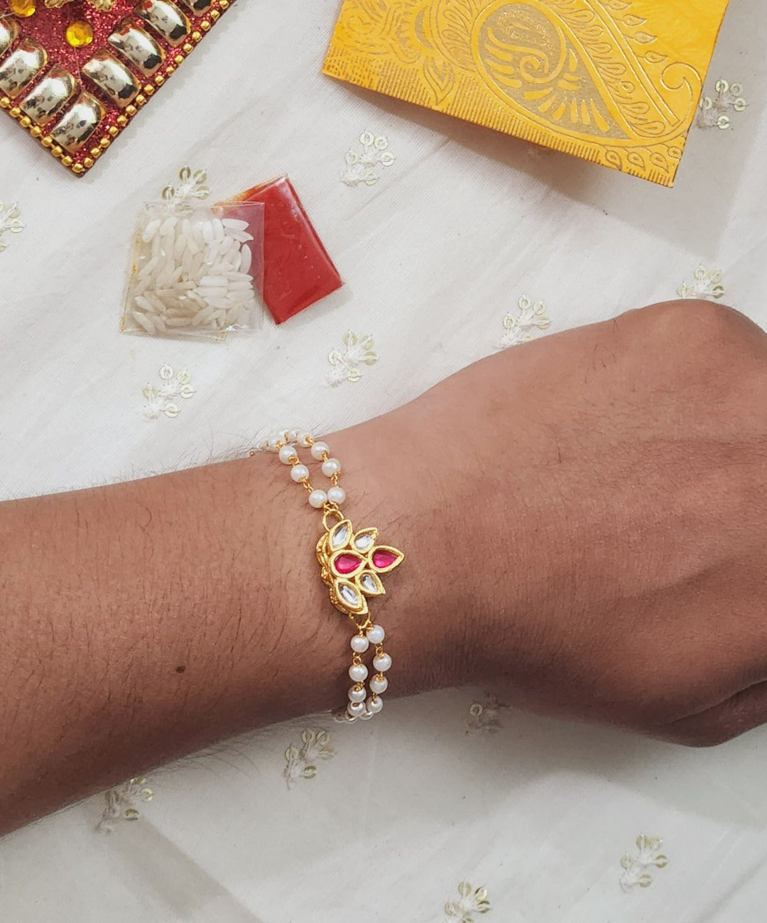 Diya Shaped Red Kundan  Bracelet Rakhi - QUEENS JEWELS