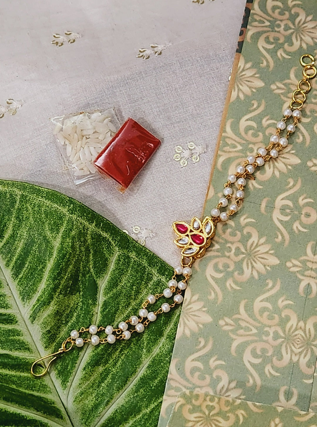 Diya Shaped Red Kundan  Bracelet Rakhi - QUEENS JEWELS