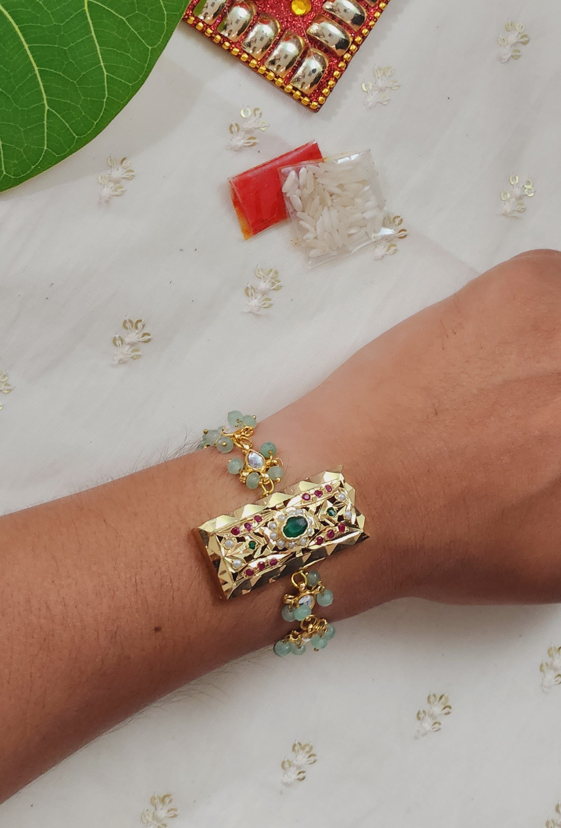 Mint Green Rakhi Bracelet with Multicolor Jadau stones work