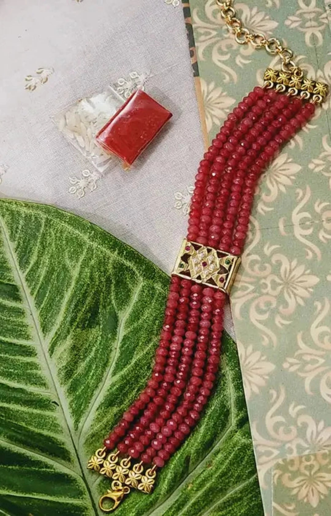 Floral Green Pearl Beaded Rakhi Bracelet With Multicolor Jadau Stone Work 