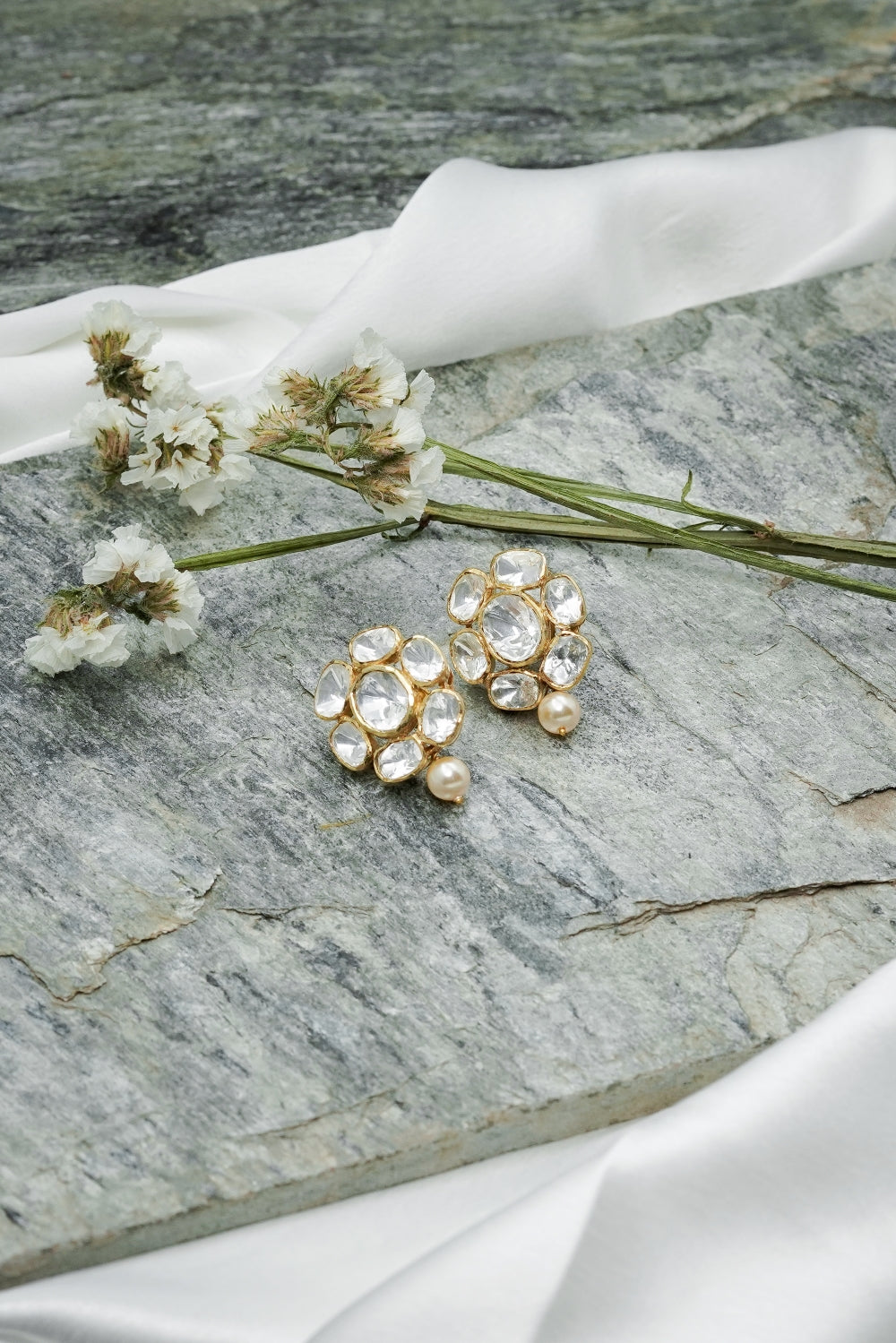 White kundan floral shaped small earrings