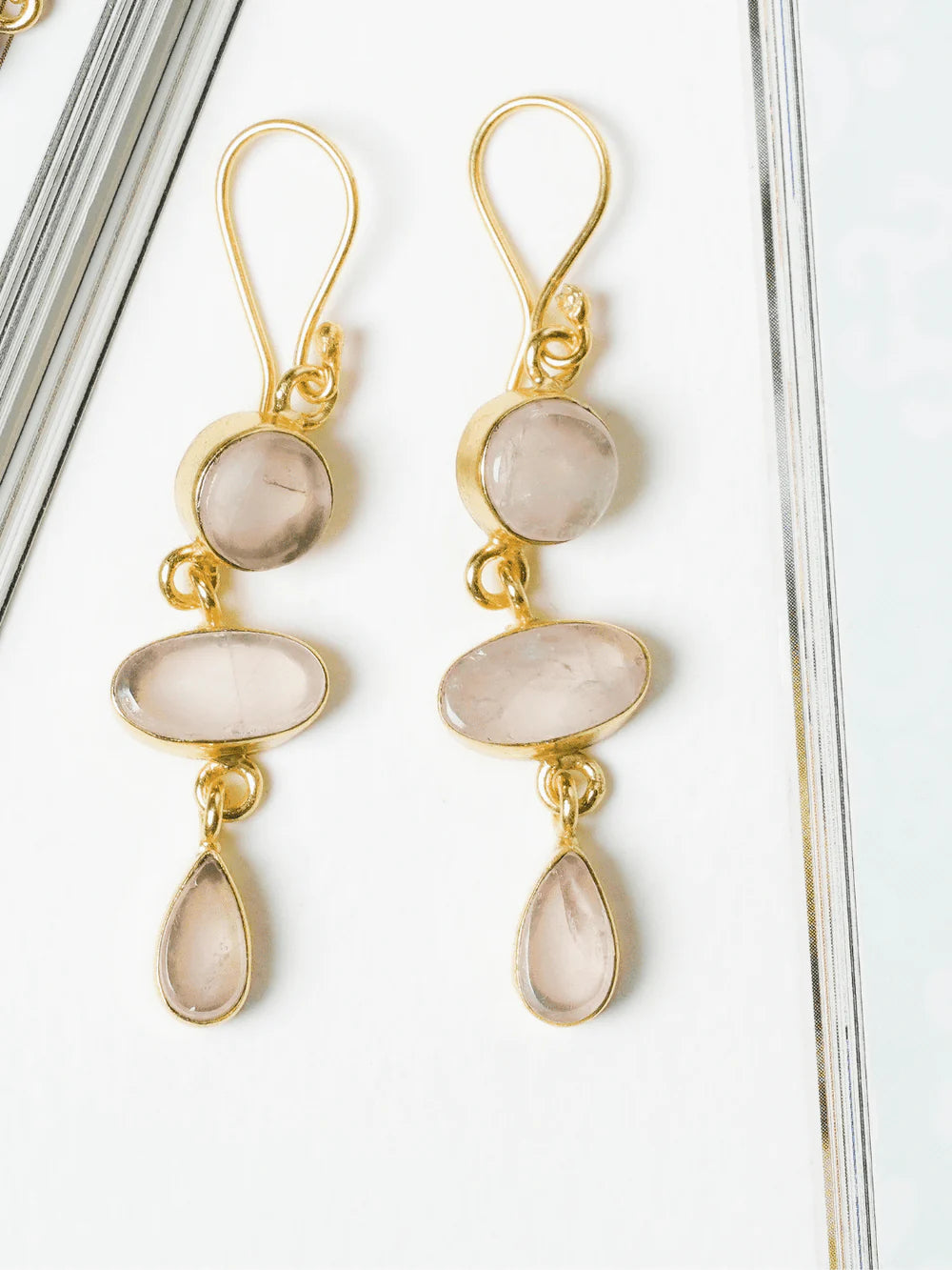 Blush Pink Multi Layer Danglers with adjustable hook closures, showcasing top-notch craftsmanship for a bold and trendy statement.