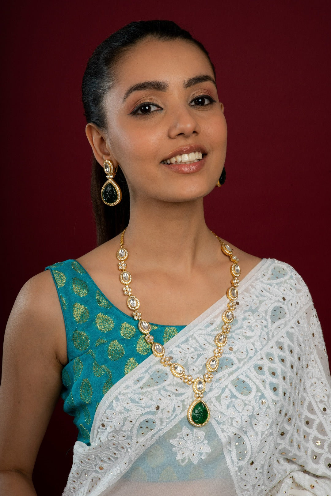 Tear drop shaped emerald & white kundan long necklace set with earrings
