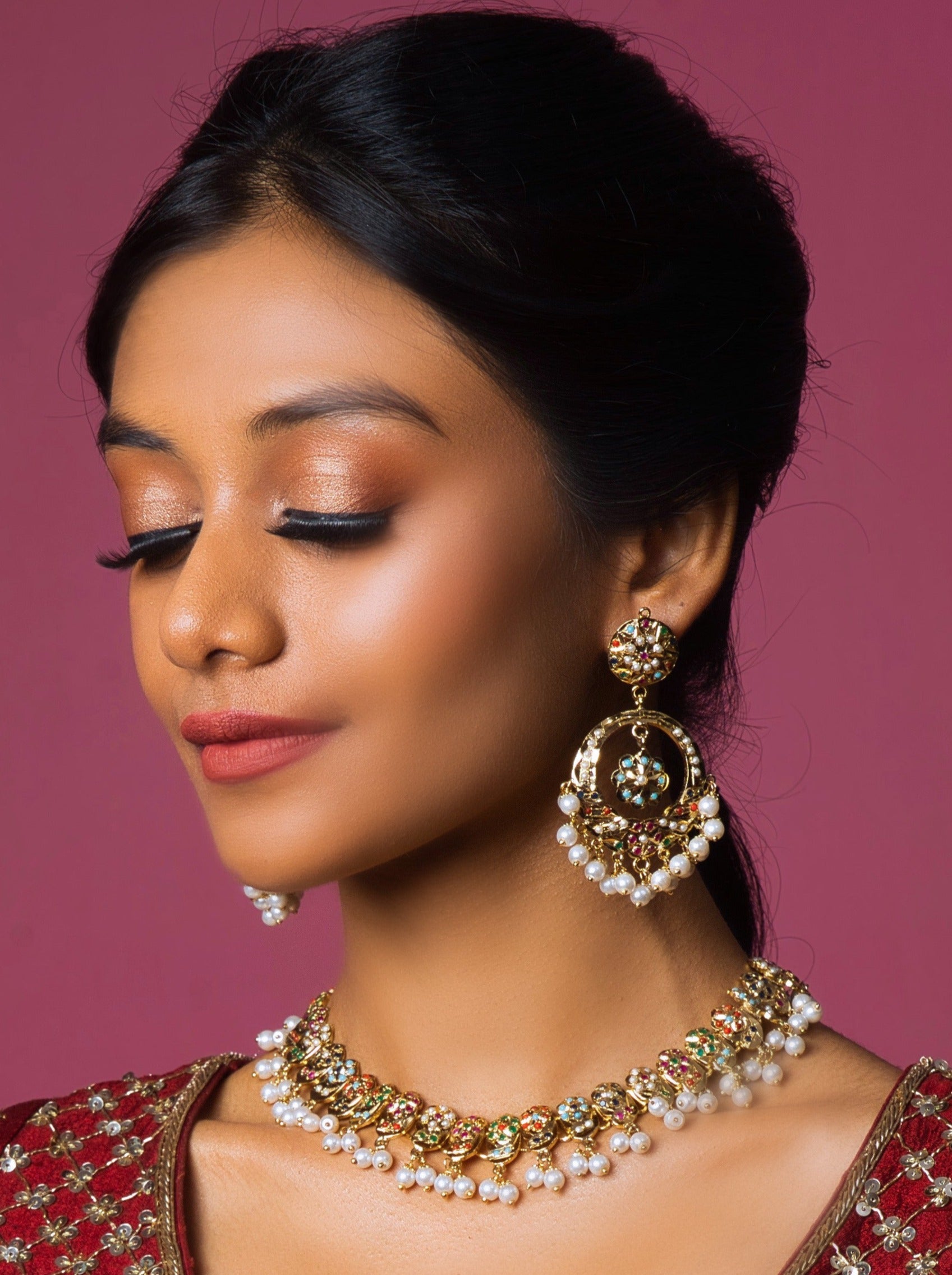 Regal Navratan Jadau Choker Set: 18 carat gold-plated elegance for a timeless, festive look.