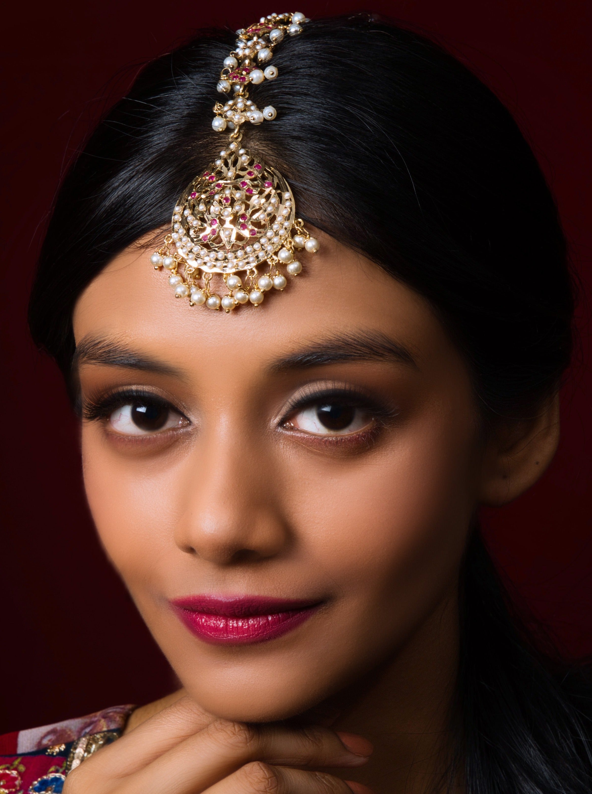 Red Dropchain Tikka: Handcrafted elegance for a timeless bridal touch.