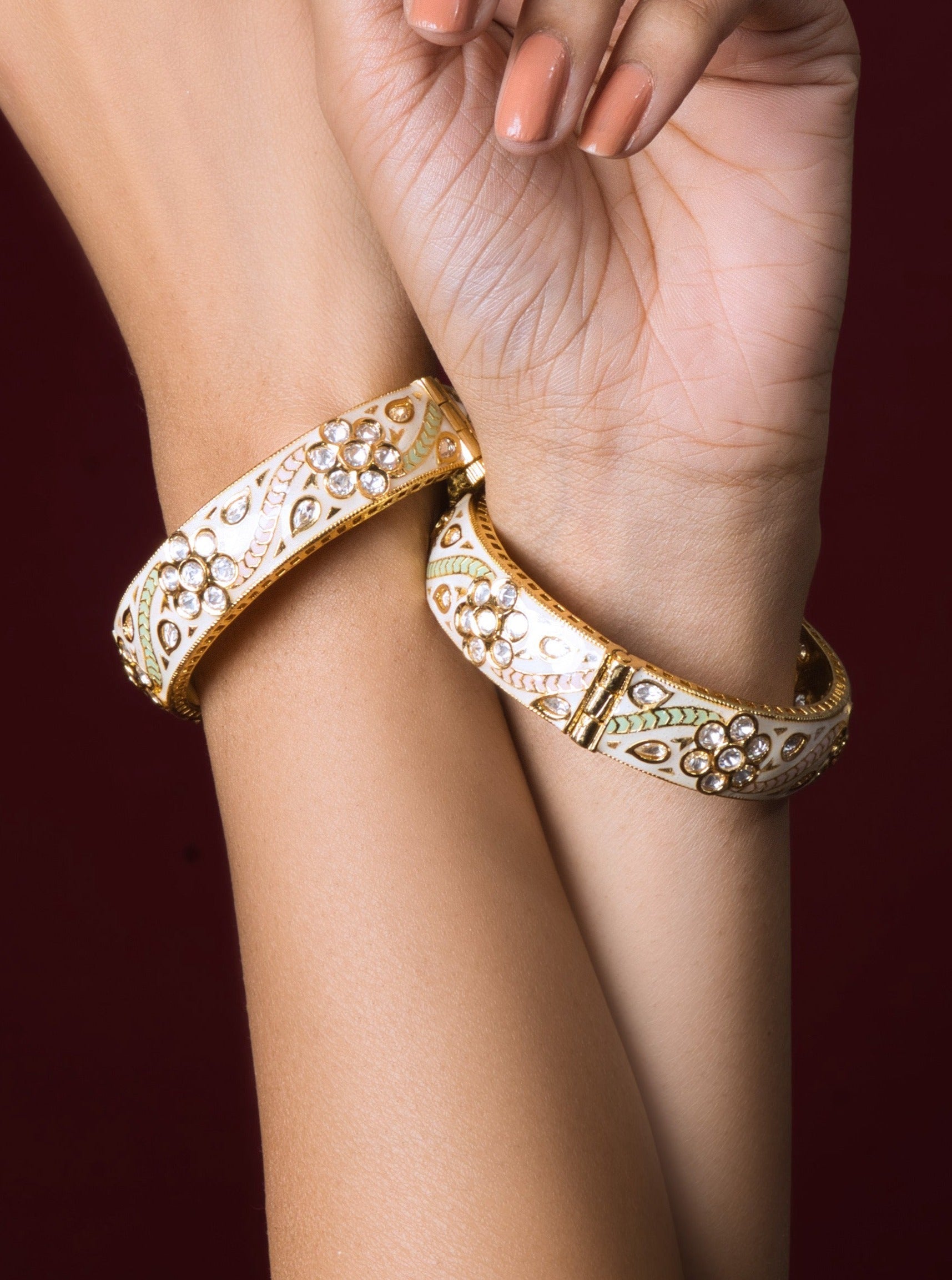 Ivory Kundan Bangles: Elegantly crafted cultural treasures, embellished for opulent charm and a perfect fit.