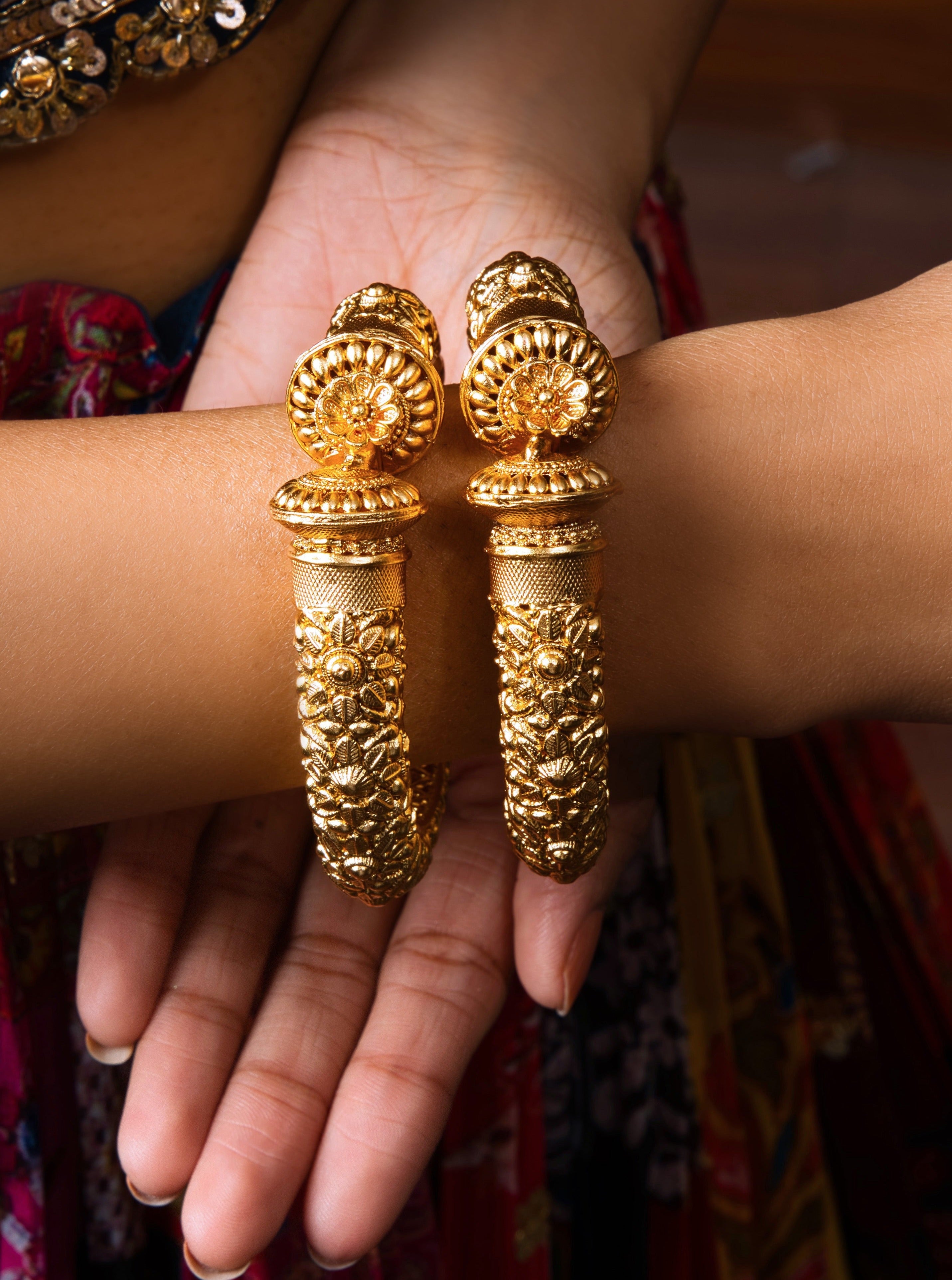 Elevate your style with the Fida Golden Toned Bangle Pair: heritage-inspired, gold-plated, and handcrafted for a meaningful addition to any outfit.