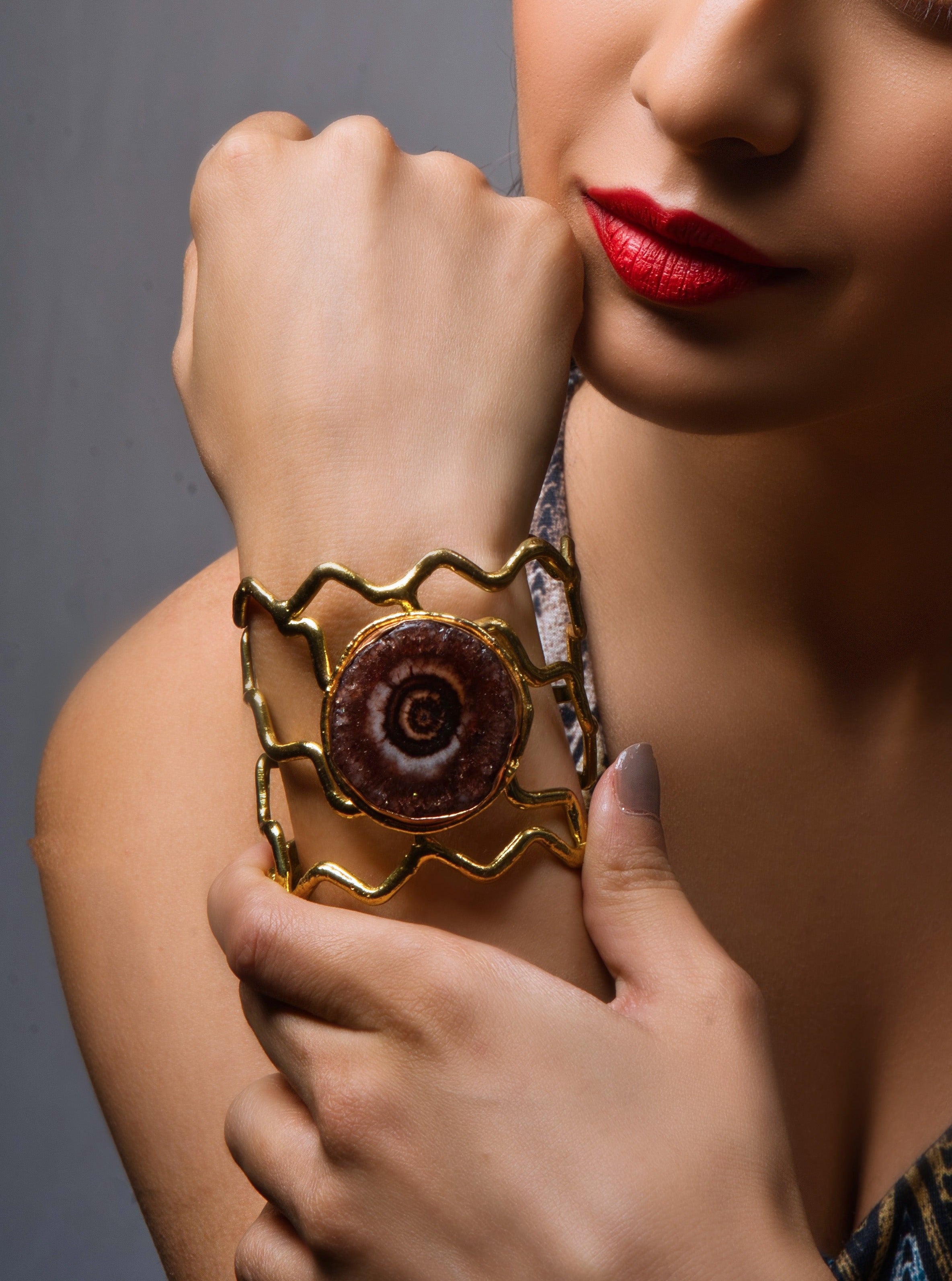 Discover luxury with our Gold Radiant Agate Cuff. Handcrafted elegance for timeless style