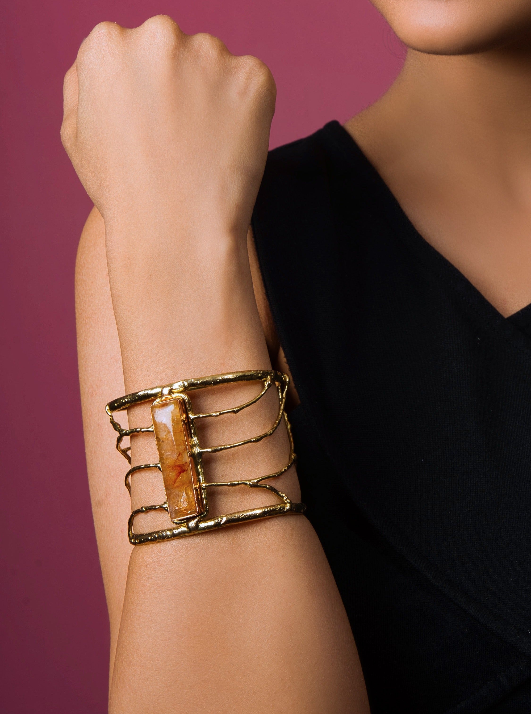 Discover luxury with our Golden Aura Gemstone Cuff. Genuine gemstones and 18k gold plating for timeless elegance