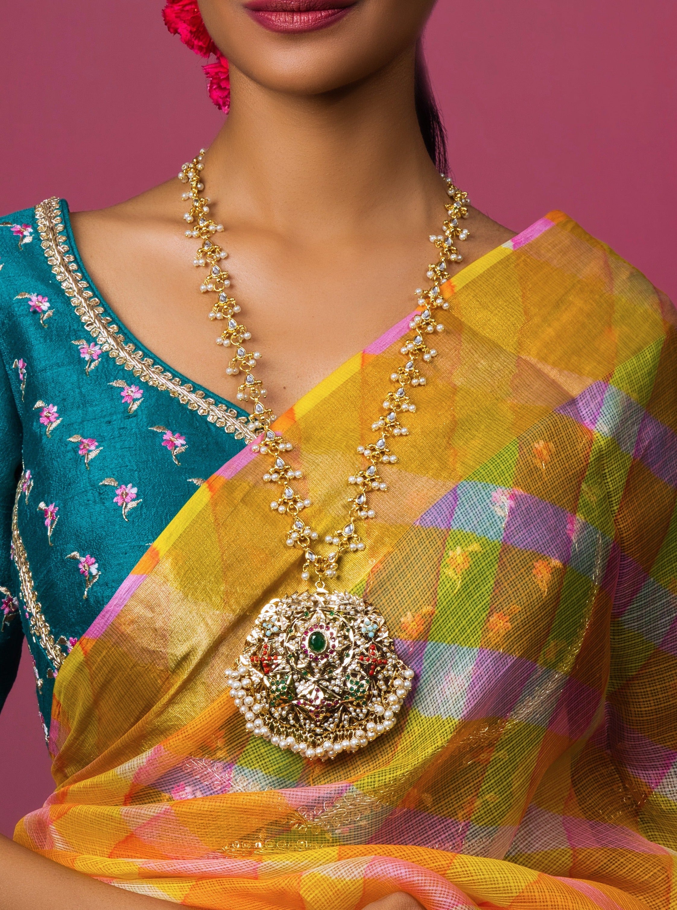 Discover craftsmanship with our Navratan Gold Plated Jadau Pendant. Handmade with artistic detail and custom gems, it's a unique addition to your collection