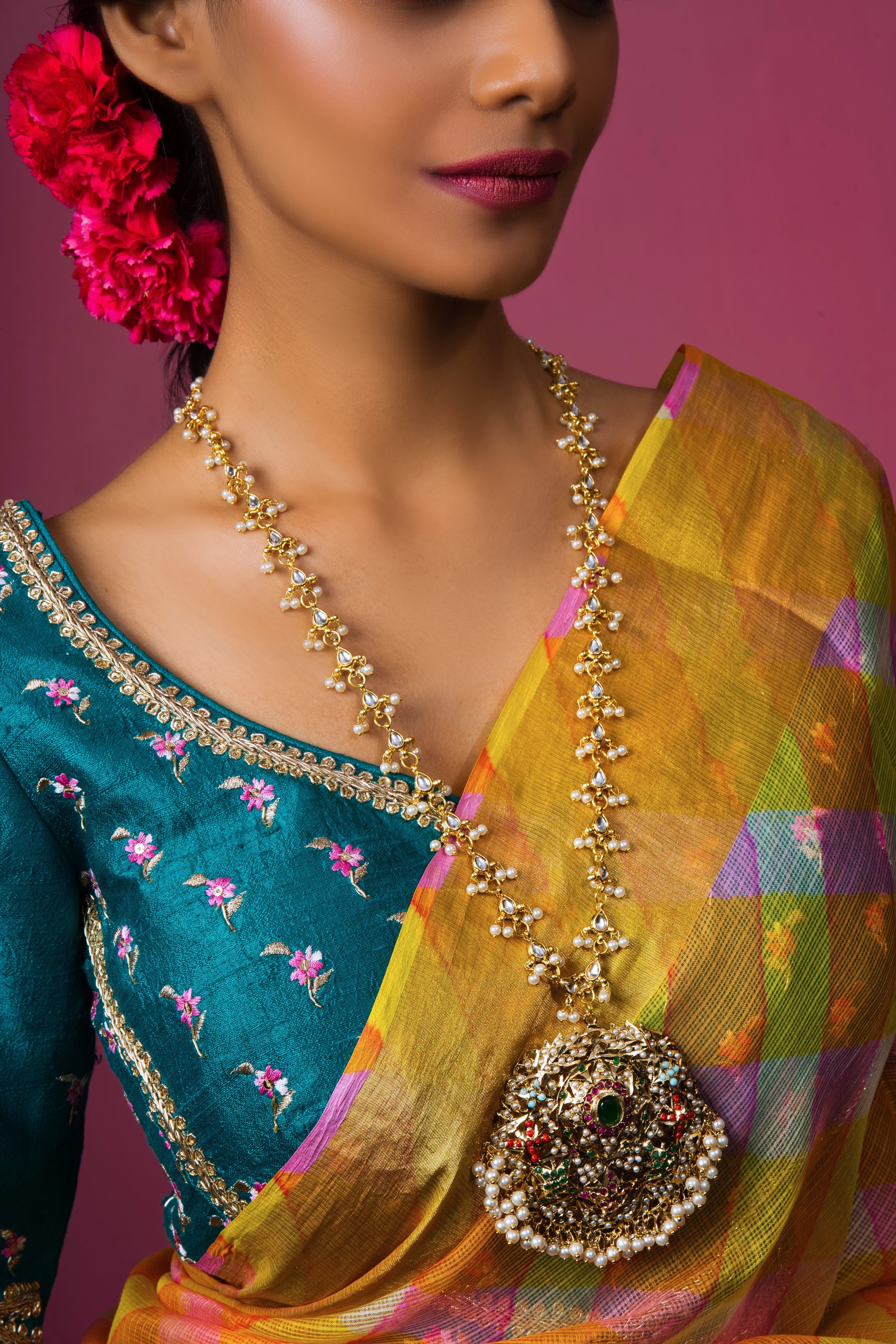 Discover craftsmanship with our Navratan Gold Plated Jadau Pendant. Handmade with artistic detail and custom gems, it's a unique addition to your collection