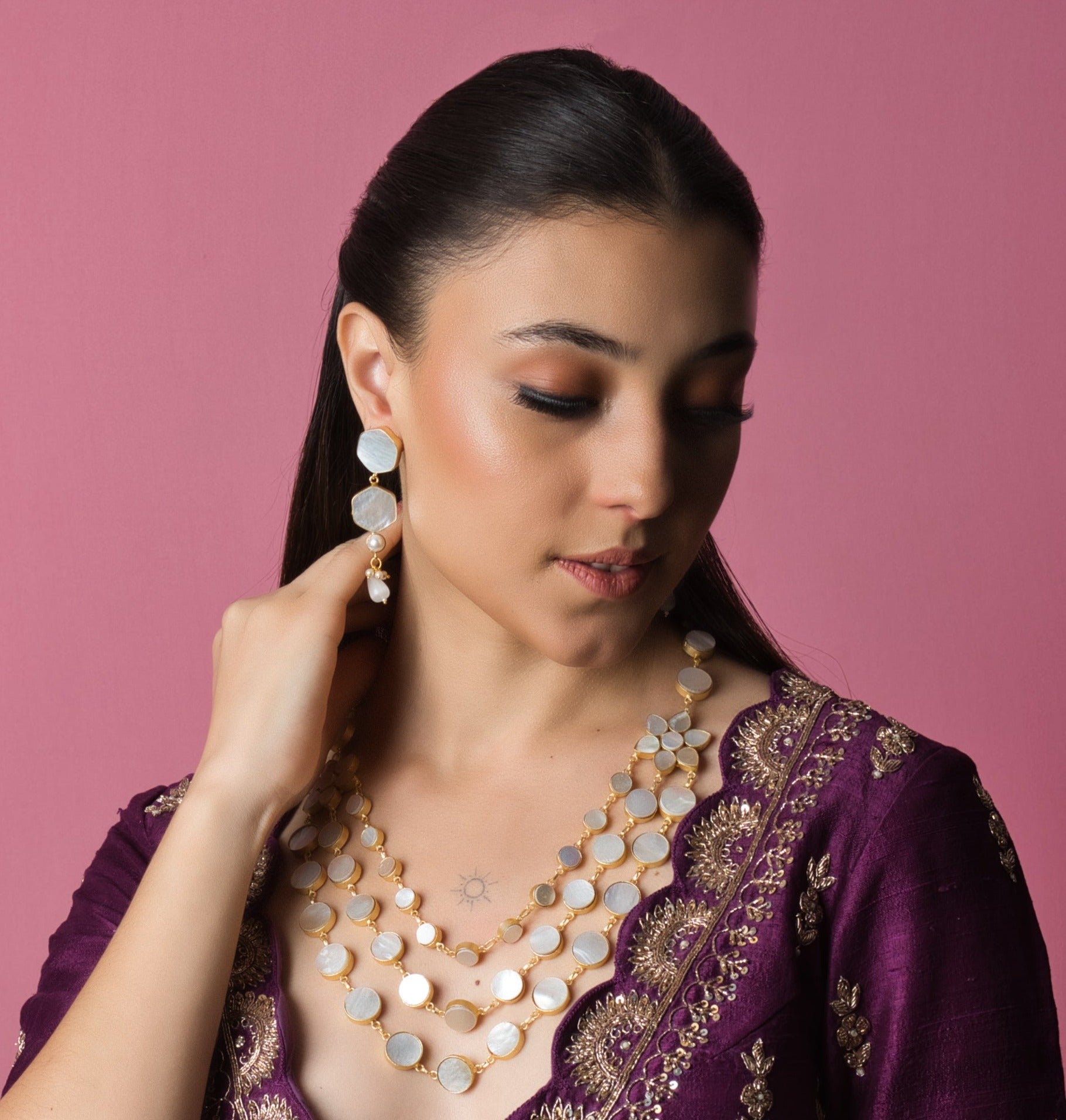 Elegant Shell Pearl Party Wear Set with matching earrings, showcasing hand-finished gems in bespoke, artisanal designs. Perfect for elevating your party look.