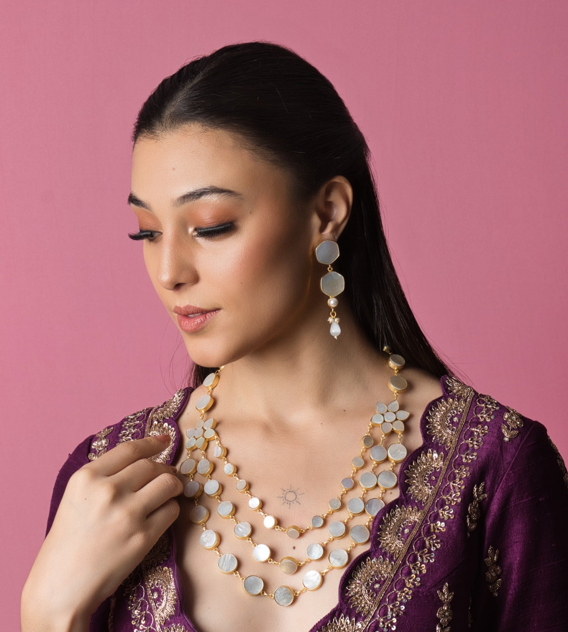 Elegant Shell Pearl Party Wear Set with matching earrings, showcasing hand-finished gems in bespoke, artisanal designs. Perfect for elevating your party look.