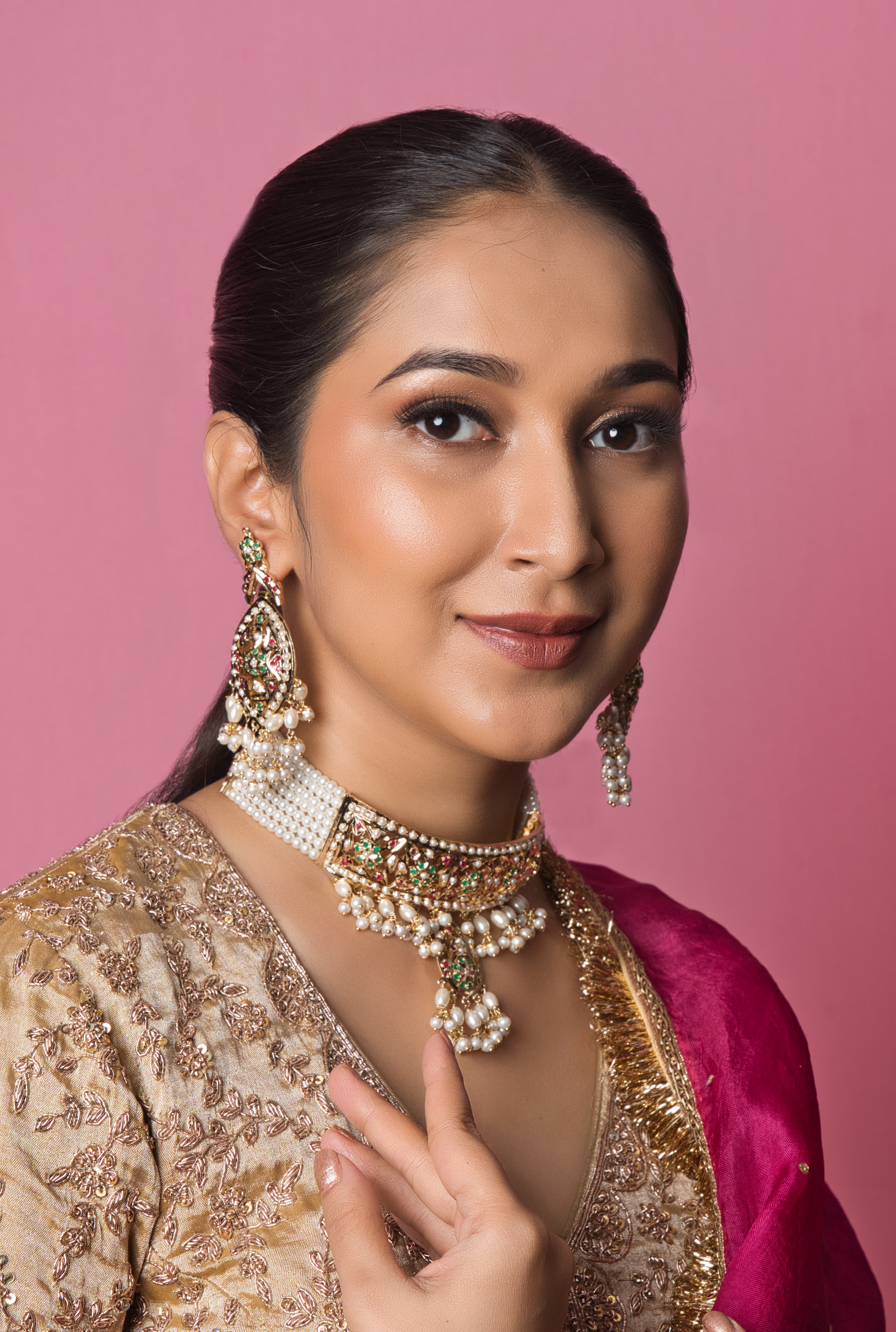 Handcrafted Jadau choker set with vibrant multicolor details, paired with matching earrings for a playful and statement-making look.