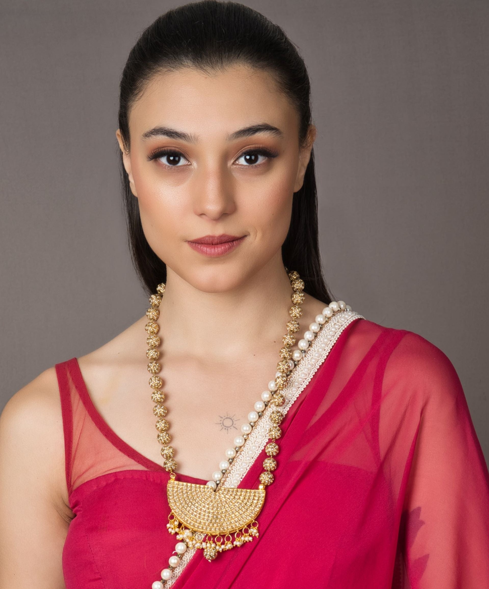 Handcrafted Sona Moti Gold Pendant with genuine pearls, combining Indian tradition and luxury. Perfect for sophisticated wardrobes, featuring an adjustable dori for customizable fit.