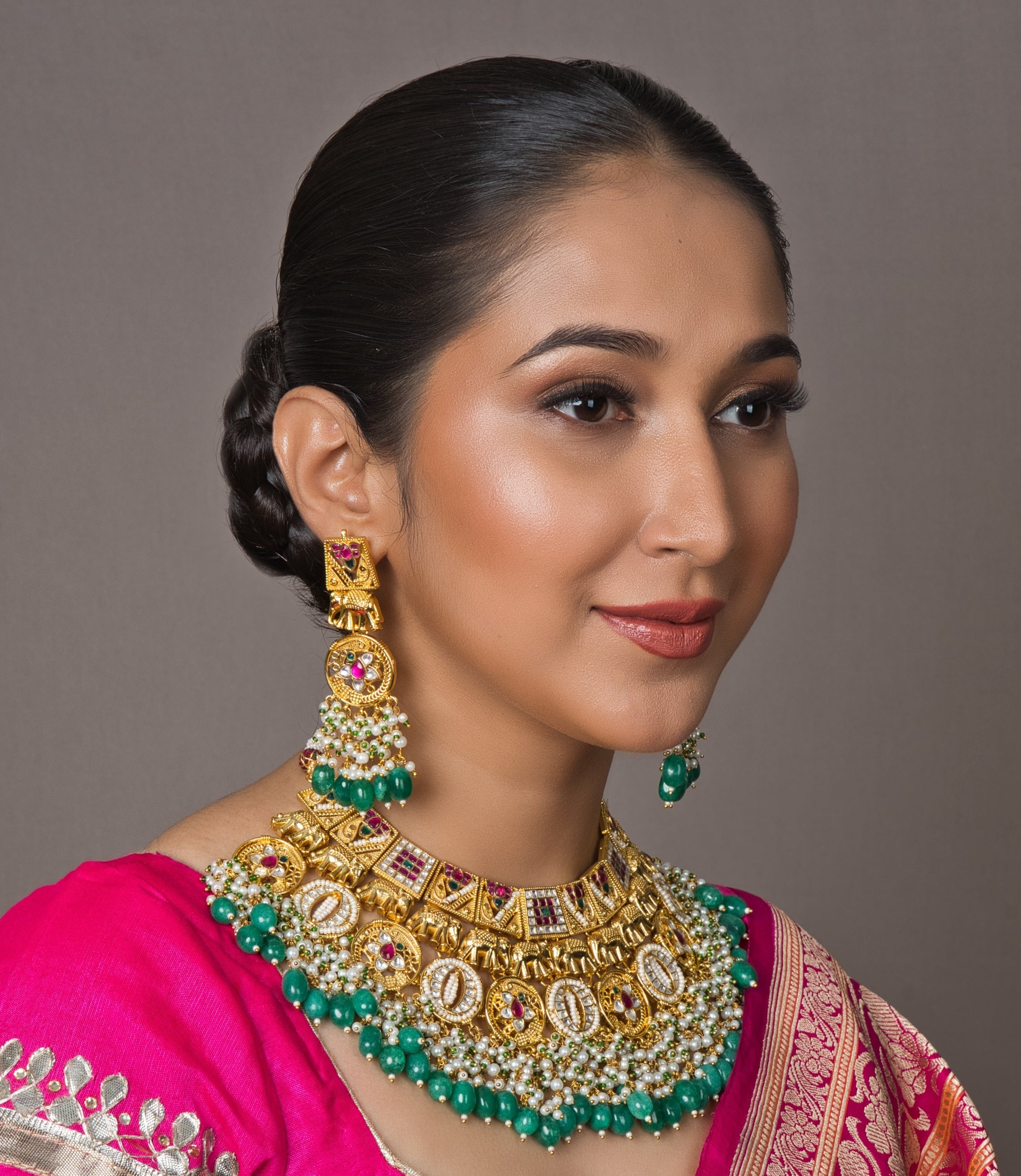 Opulent Temple Bridal Choker Set with intricate temple motifs and matching elegant earrings. Perfect for adding a luxurious touch to your bridal look.