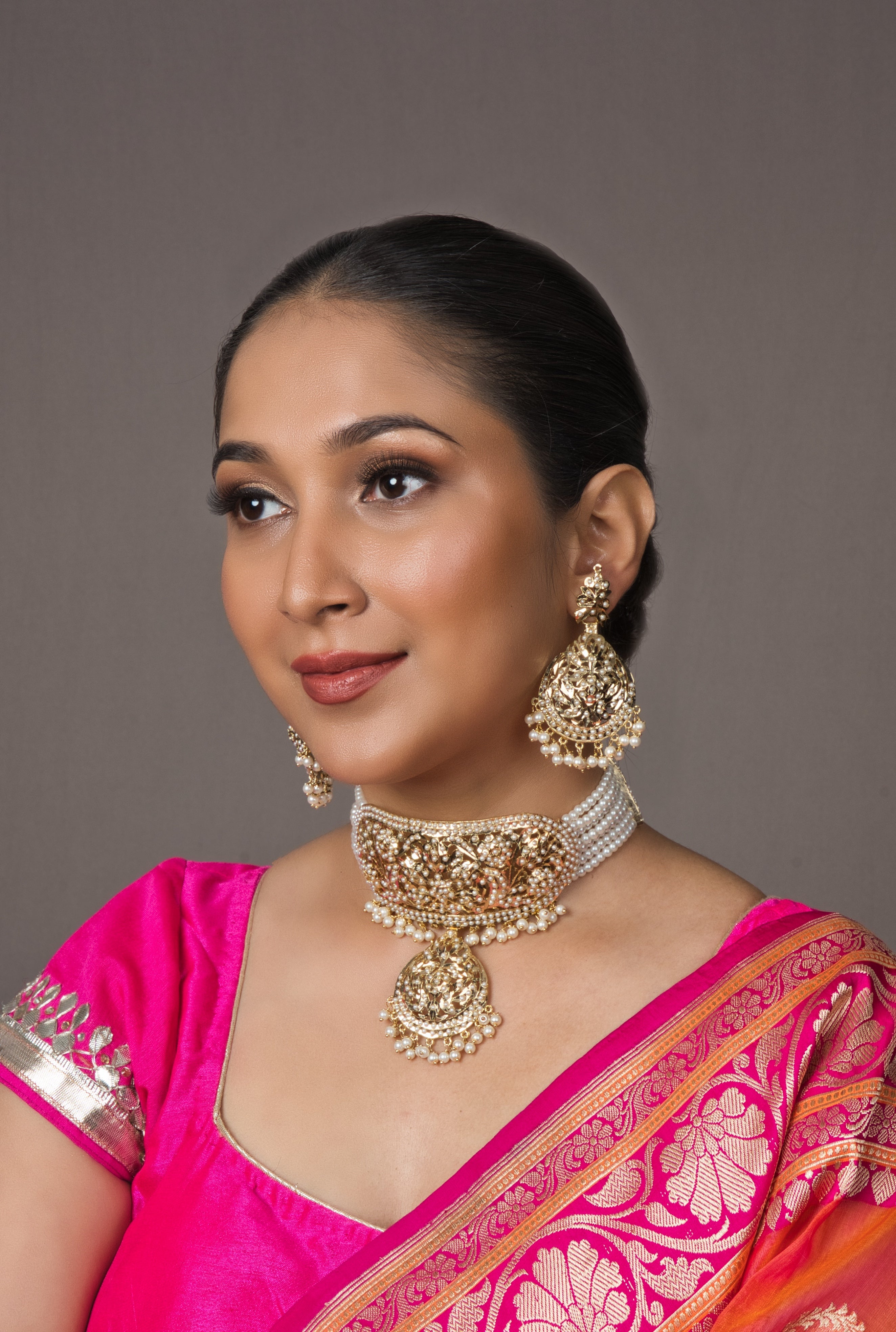  Bridal White Jadau Neckhugging Choker Set with adjustable Dori closure and matching earrings, crafted with intricate semi-precious stones for a dazzling bridal look.