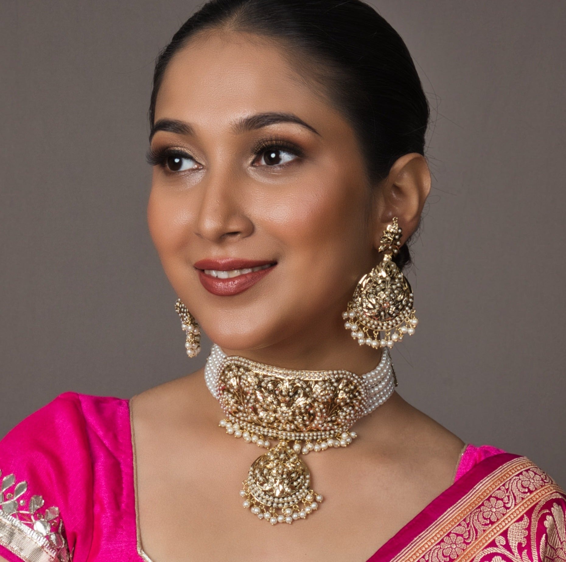 Bridal White Jadau Neckhugging Choker Set with adjustable Dori closure and matching earrings, crafted with intricate semi-precious stones for a dazzling bridal look.