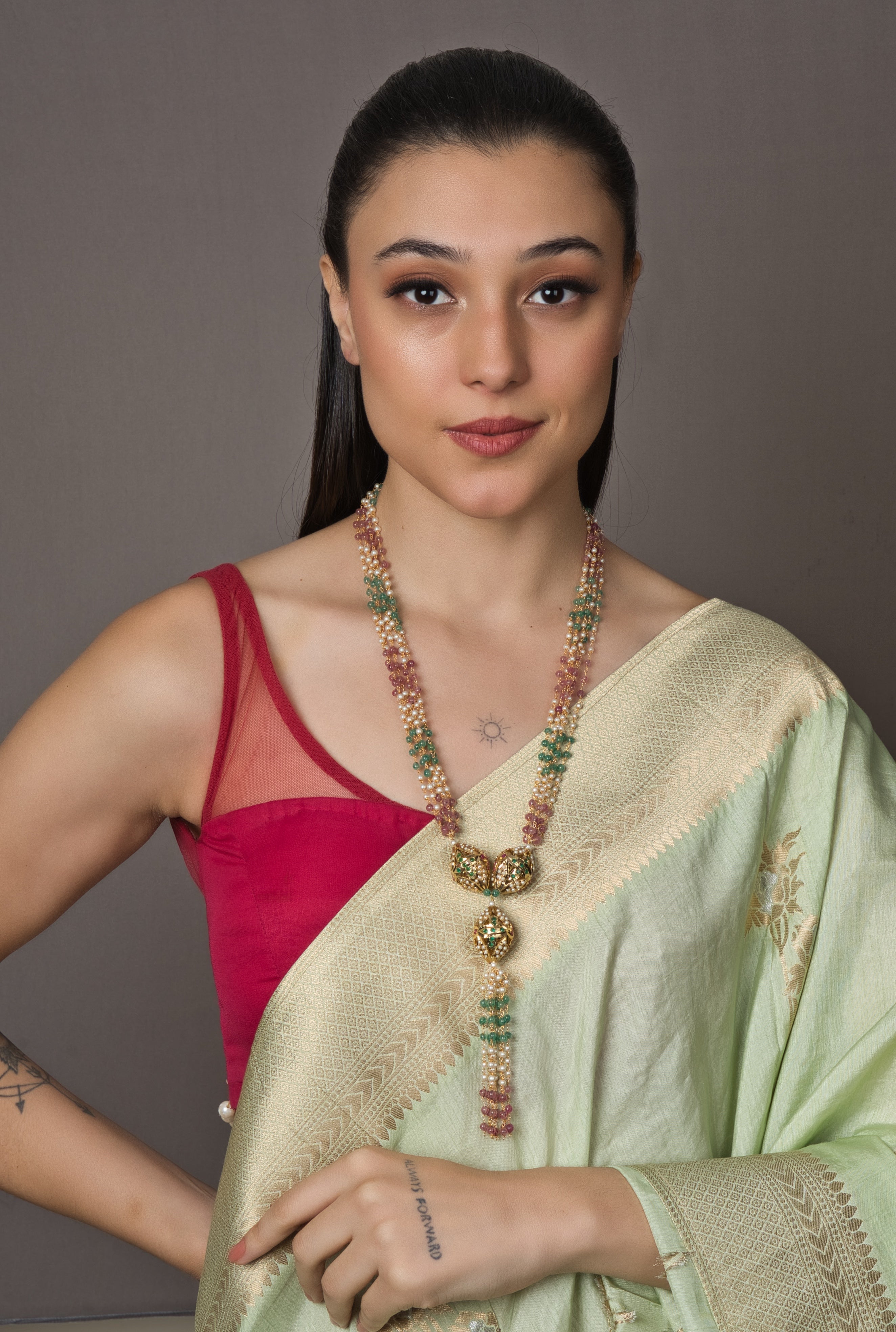 Luxurious Jadau Multistring Beaded Necklace with intricate details and multiple bead strings.