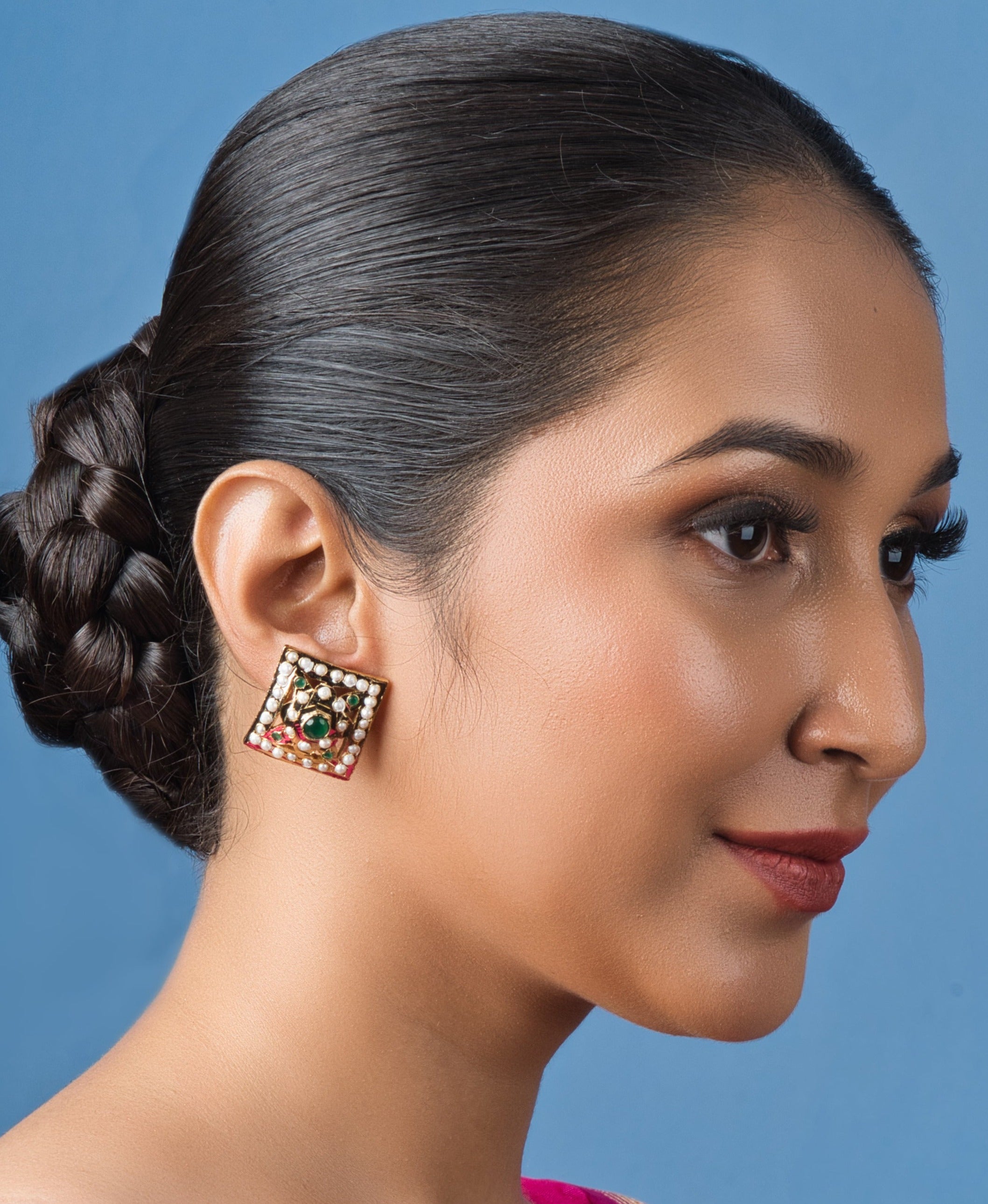 Handcrafted square green Jadau stud earrings, perfect for festive occasions, featuring intricate traditional designs.