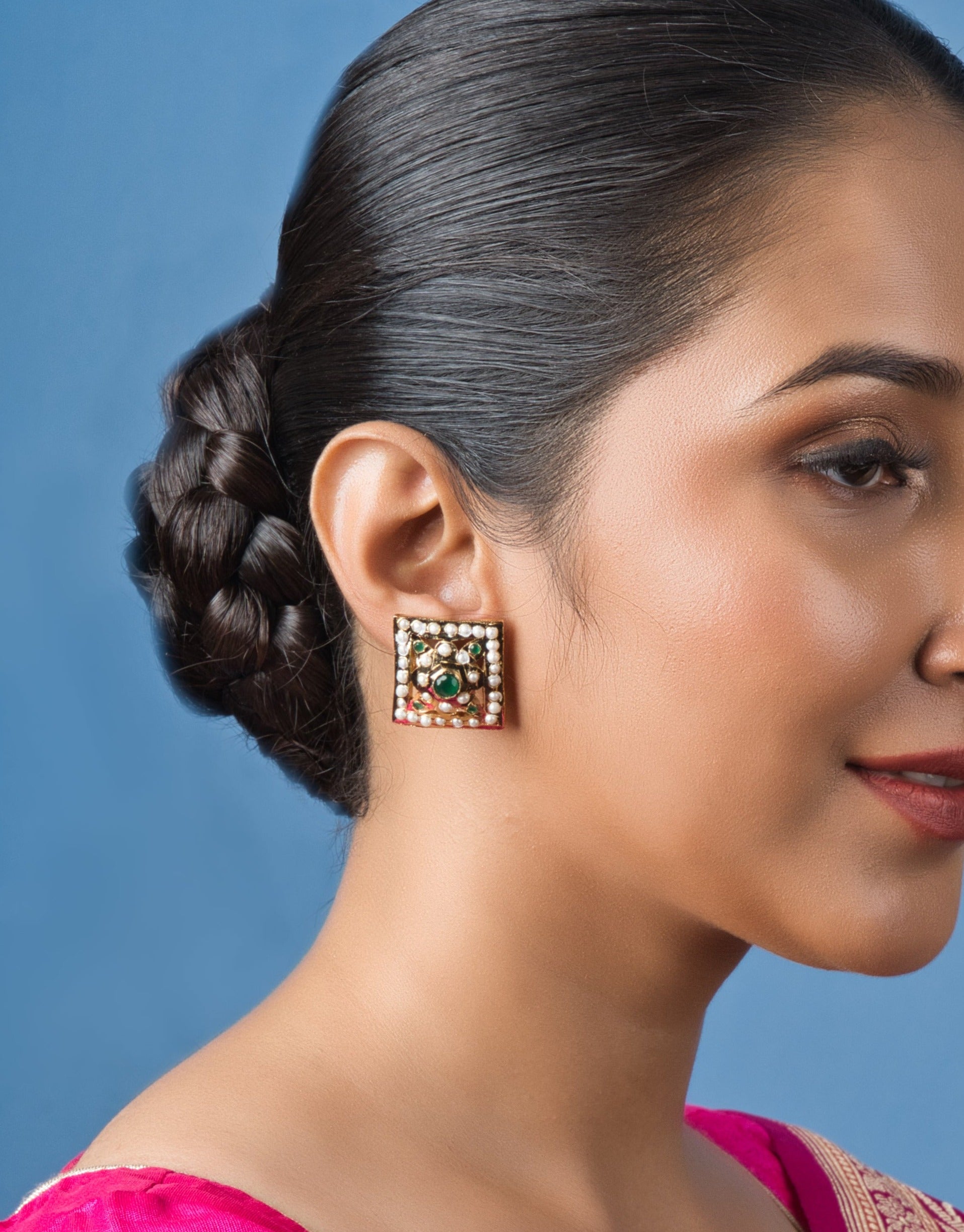 Handcrafted square green Jadau stud earrings, perfect for festive occasions, featuring intricate traditional designs.