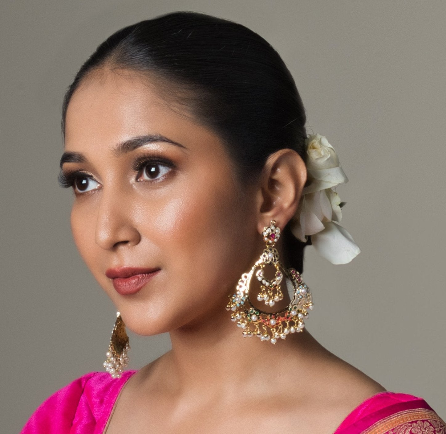 Handcrafted Elegant Navratan Jadau Chaandbali: Traditional festive earrings with navratna gems and intricate jadau work, perfect for special occasions.