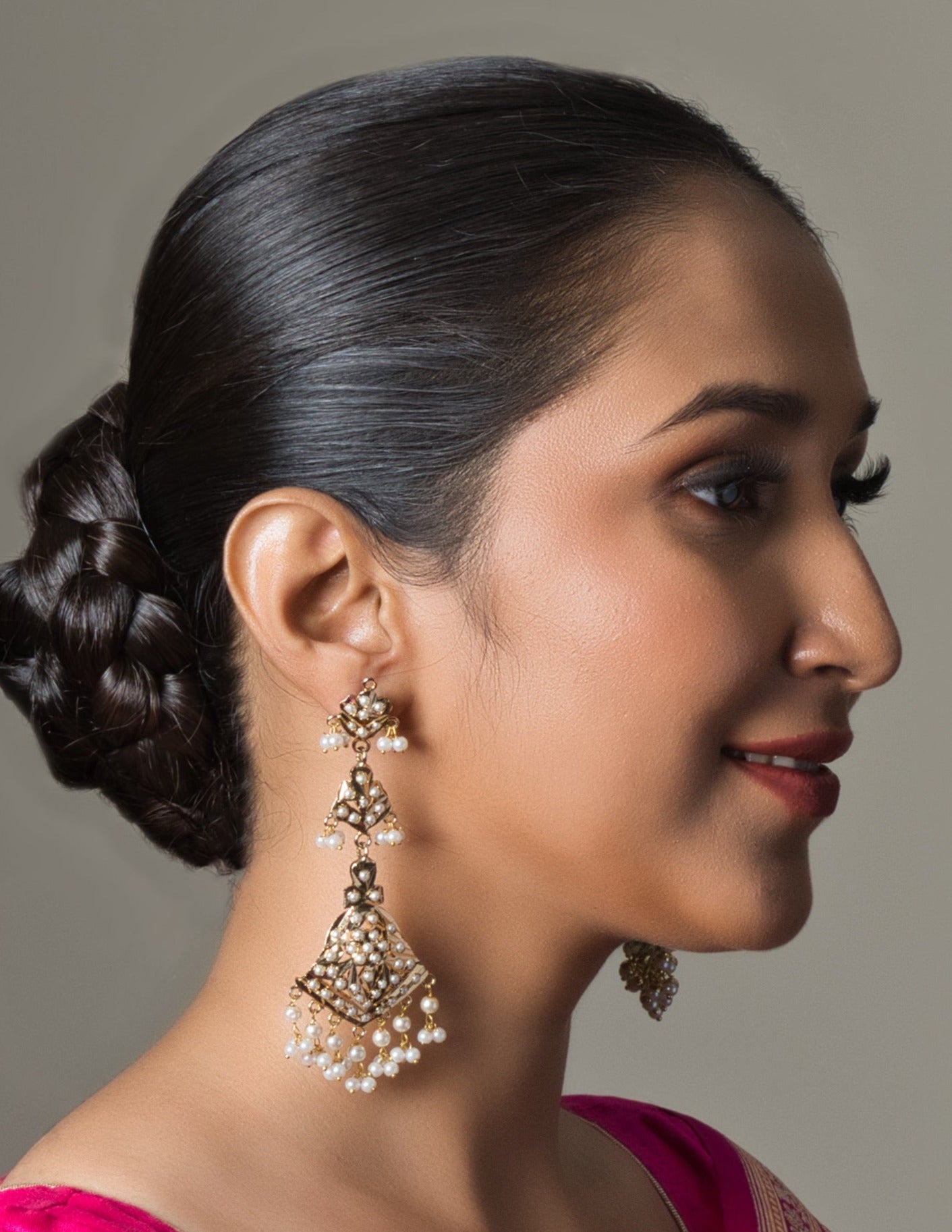 Handcrafted Elegant Long White Jadau Earring, adorned with intricate traditional designs, perfect for festive occasions.