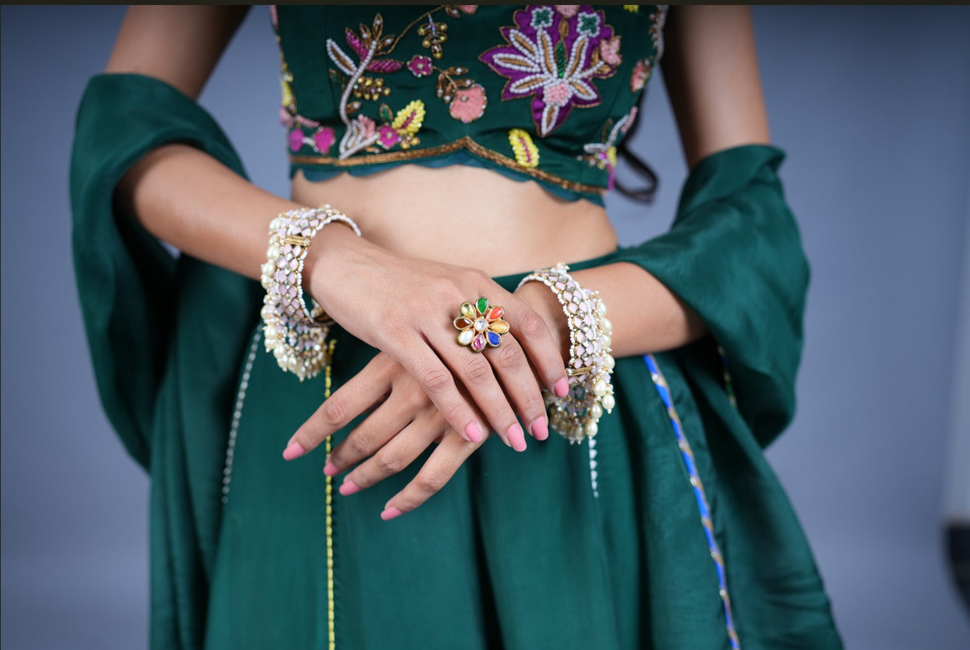 Opulent Navratan Polki Kundan Ring, handcrafted with unique artisanal design and hand-finished gems.