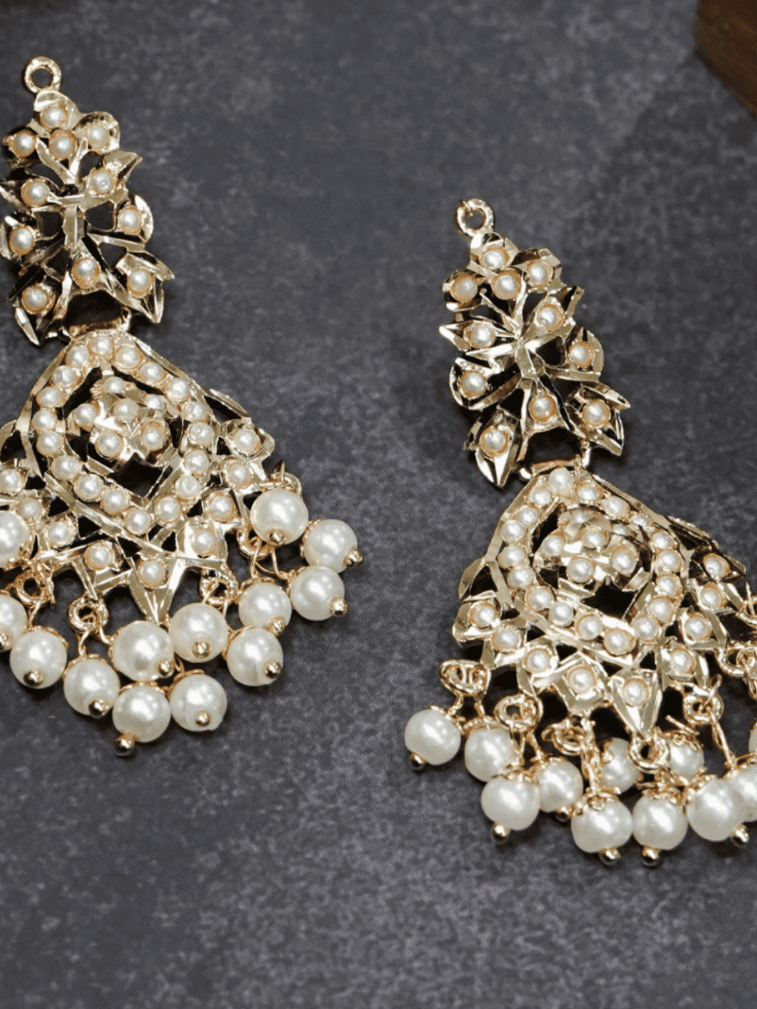 All white pearls jadau chaandbali earrings.
