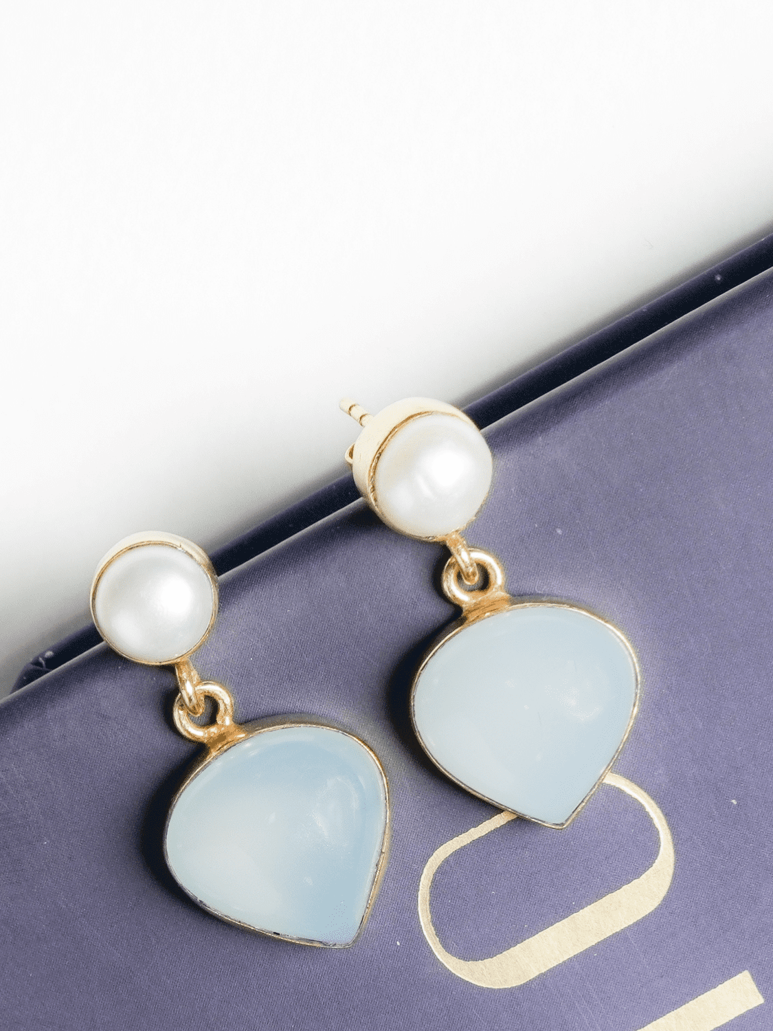 Powder blue heart shaped small dangler earrings
